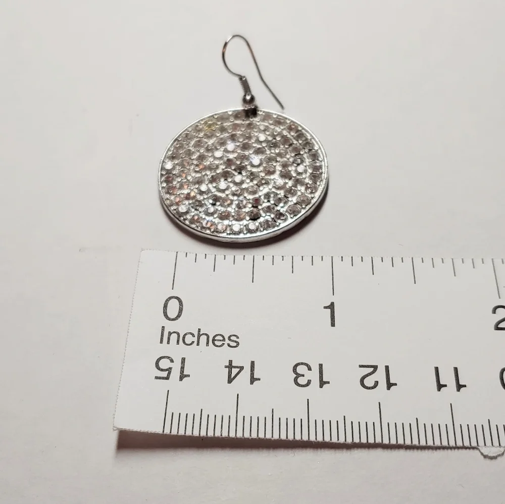 Faux diamond earrings. Large round, pierced ears